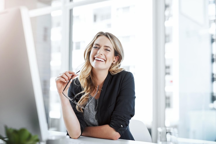 Photo desk portrait and woman in office smile and business lawyer with computer legal research and online law firm attorney and ready for helping glasses and preparation for contract table or person