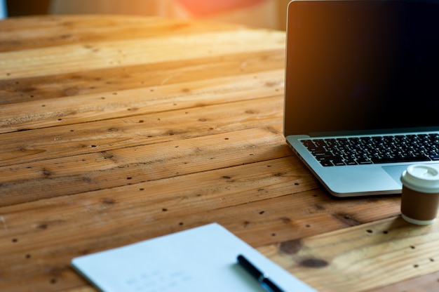 A desk with a business computer and a note on the desk. Business concept with copy space.