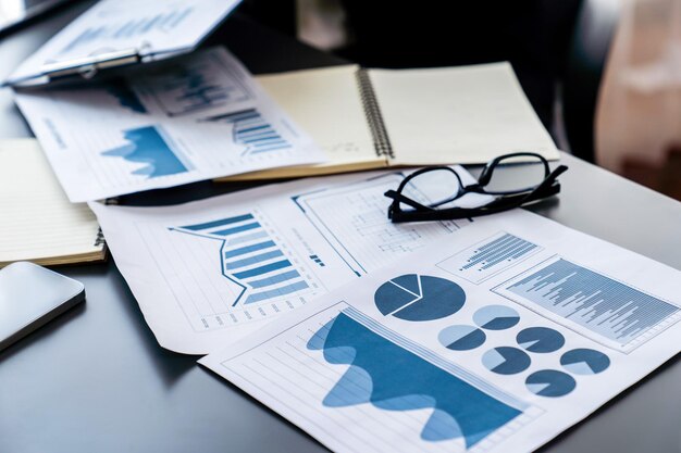 A desk with papers and a graph on it