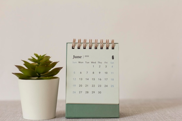 Desktop calendar for June 2022 on the table