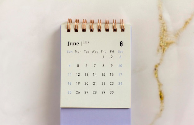 Desktop calendar for June 2023 on a light background