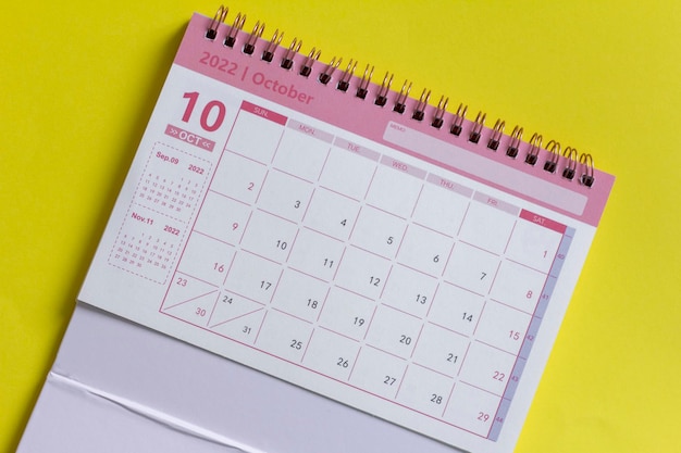 Desktop calendar for October 2022 on a yellow background