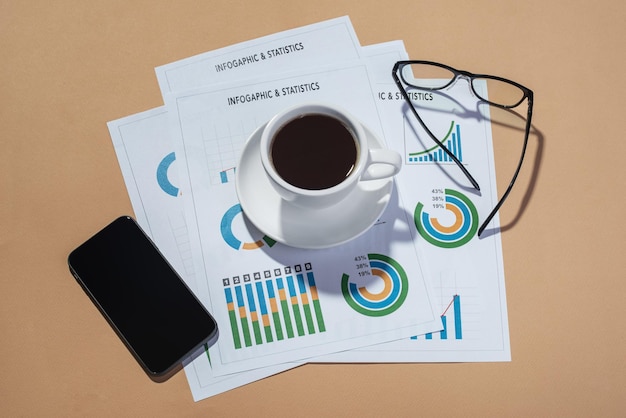 Desktop Coffee with papers and phone on the table