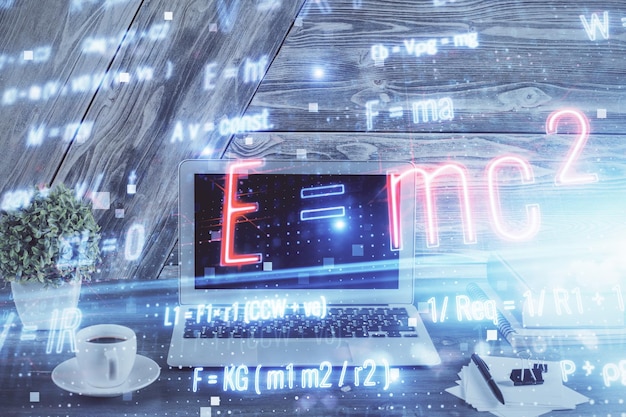 Desktop computer background and formula hologram writing Double exposure Education concept