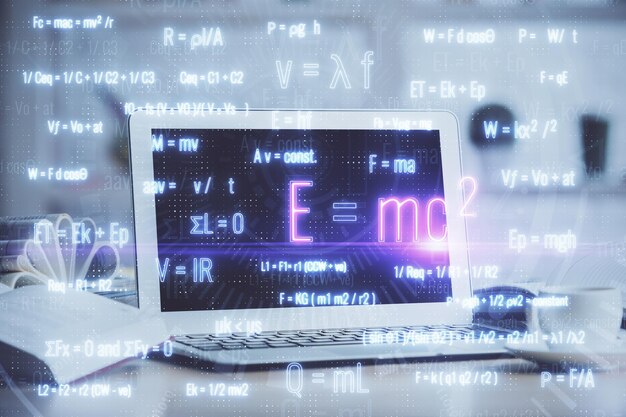 Photo desktop computer background and formula hologram writing double exposure education concept