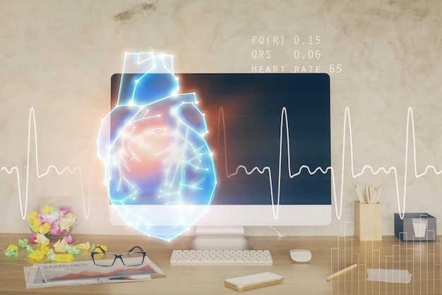 desktop computer background and heart drawing double exposure medical study and healthcare concept