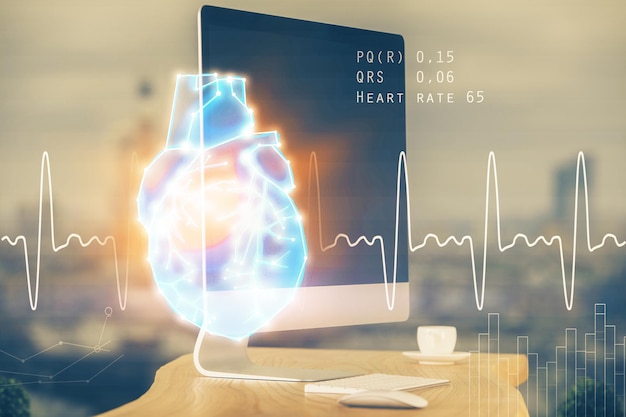 desktop computer background and heart drawing double exposure medical study and healthcare concept
