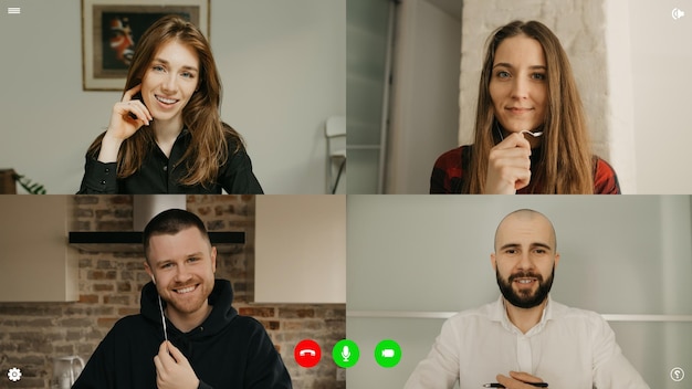 Photo a desktop computer screen view of the telecommunications application during a video chat on which colleagues are happy to see each other alive. a multi-ethnic business team in an online meeting