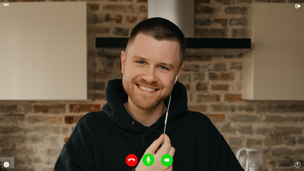 A desktop computer screen view of the telecommunications application during a video chat on which the team lead is listening to employees a reportage about a business from home.