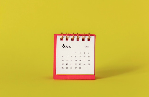 Desktop mini calendar for june 2022 on a yellow background