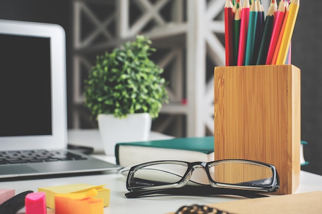 Desktop with glasses and laptop