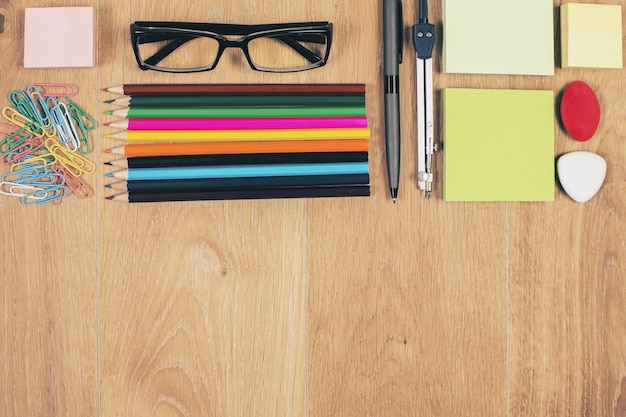 Desktop with stationery and glasses