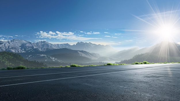 Photo desolate paved pathway and peaks against clear sky during daylight