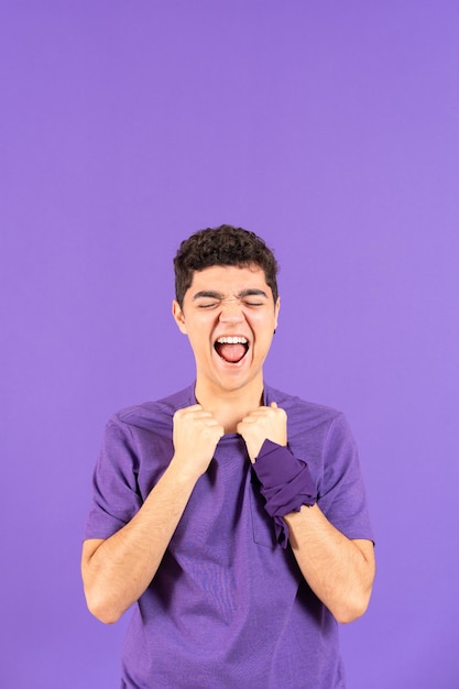 Despaired hispanic boy shouting with copy space