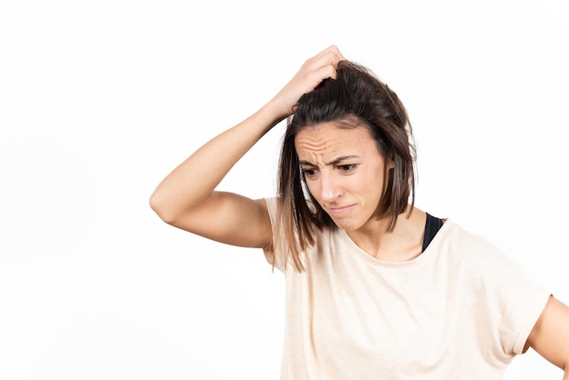 A despaired and worried brunette young woman. Mental health and psychology concept.