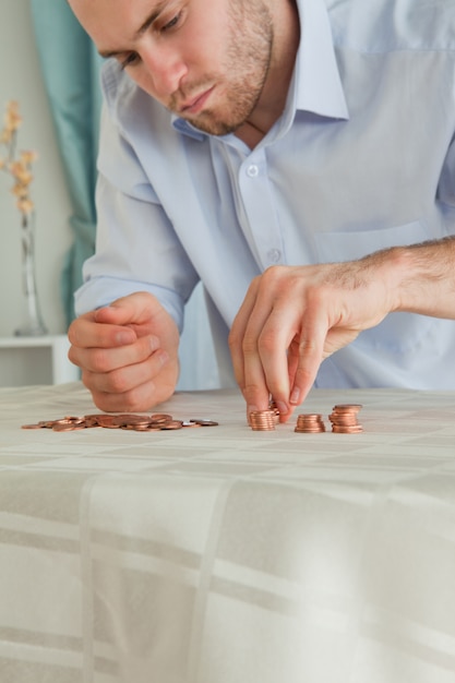 Desperate businessman counting his small change