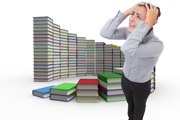 Desperate businesswoman against steps made out of books