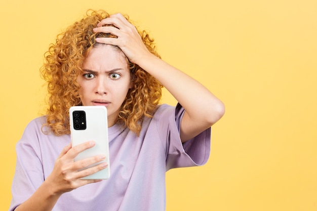 A desperate woman looking at mobile phone