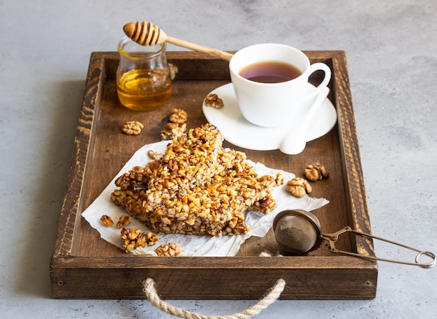 Dessert bars made of walnuts in a honey caramel