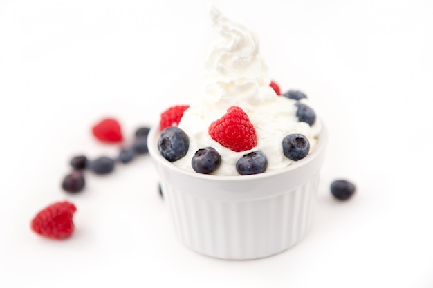 Dessert of berries and whipped cream