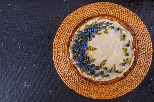 Dessert blueberry cheesecake with fresh berries and cream,