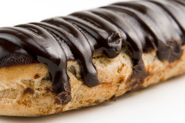 Dessert Bomba de Chocolate. Brazilian traditional ÃÂ©clair on a white background. Close-up macro.