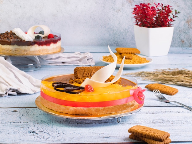 dessert cake with food styling books and some english papers