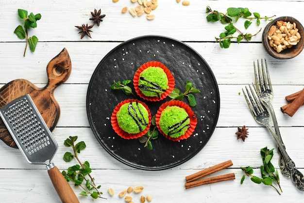 Dessert Chocolate green cakes with coconut Sweets Top view Rustic style