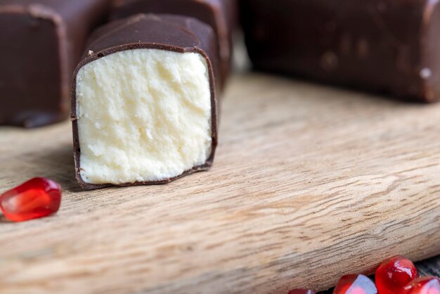 Dessert of creamy filling and chocolate on a board