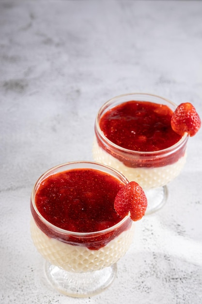 Dessert of creamy pudding and strawberry jam Panna cotta