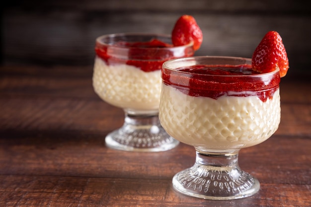Dessert of creamy pudding and strawberry jam panna cotta