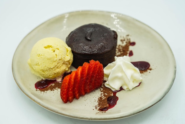 Dessert in a fancy restaurant, in the form of carrot cake, crepe and ice cream.