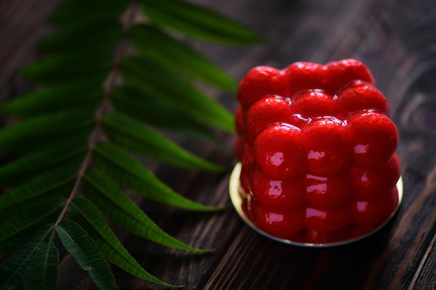 Dessert in the form of a cube. Cake mousse. Red cake.