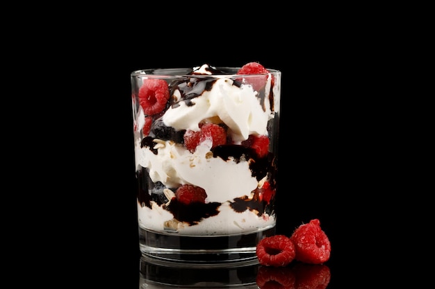 Dessert in glass with cream berries and liquid chocolate