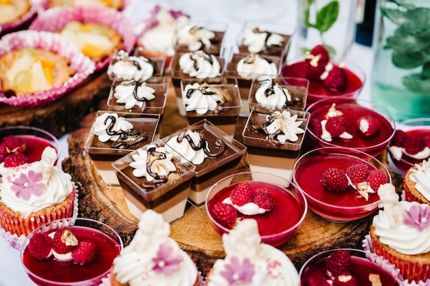 Dessert jelly in glass Delicious Italian dessert Panna Cotta with jelly Festive sweet table with baking