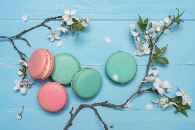 Dessert macaroons on a blue wooden background