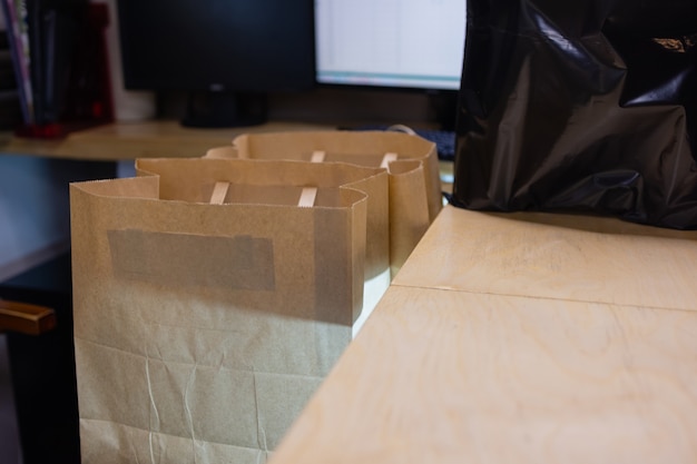 Dessert paper bag waiting for customer on counter in modern\
cafe coffee shop food delivery cafe rest...