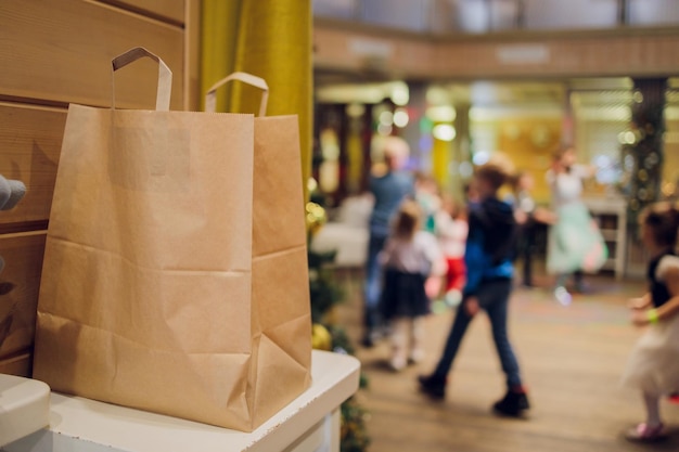 Dessert paper bag waiting for customer on counter in modern cafe coffee shop food delivery cafe restaurant takeaway food