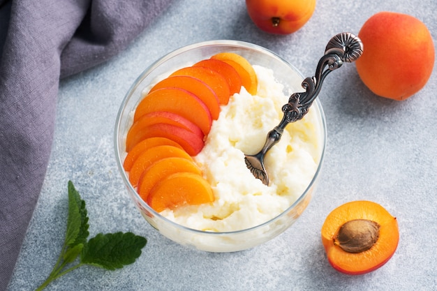 Dessert of sweet cottage cheese and fresh apricots