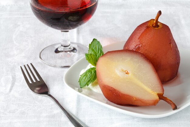 Dessert with pear stewed in wine sauce