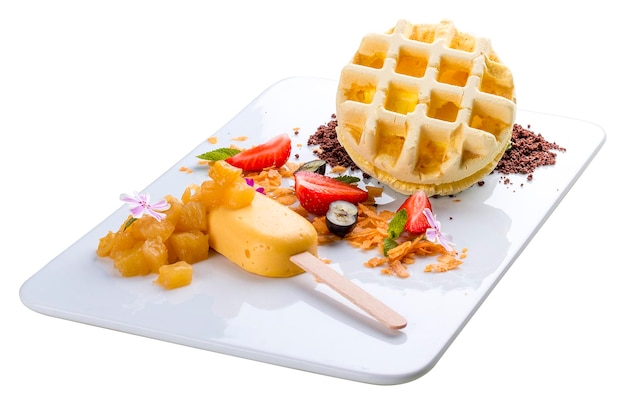 Dessert with waffle and creme brulee on a white background