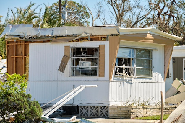 Destroyed by hurricane Ian suburban house in Florida mobile home residential area Consequences of natural disaster