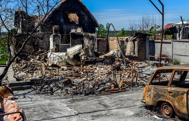 destruction of houses cars as a result of the war in ukraine