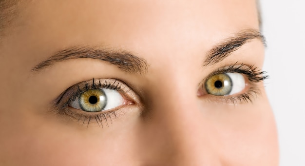 Detail of beautiful green eyes on a young girl