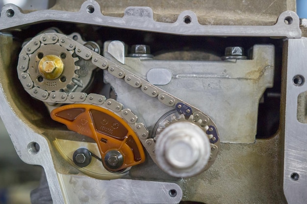 Detail of the car engine with gears and chain close up