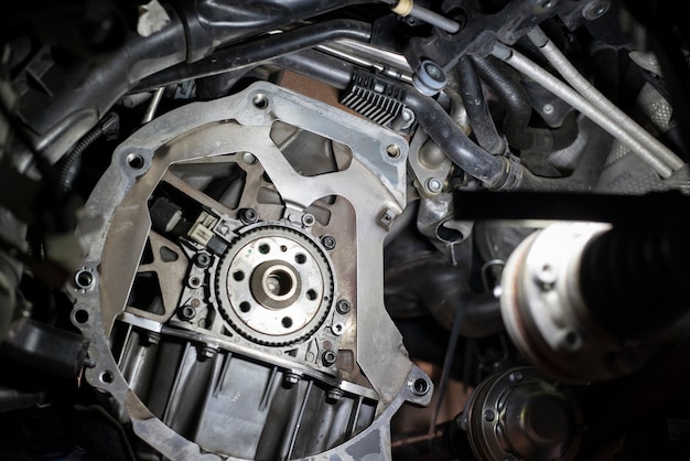 Detail of Car flywheel assembly in a workshop, car reparation engine