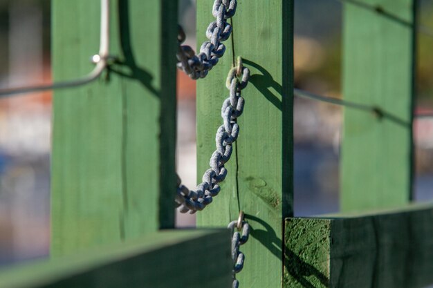 Detail of a chain on a green bridge in rio de janeiro brazil