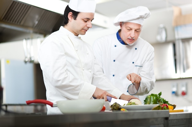 Detail of a Chef at work in his Kitchen