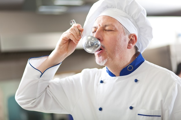 Detail of a Chef at work in his Kitchen