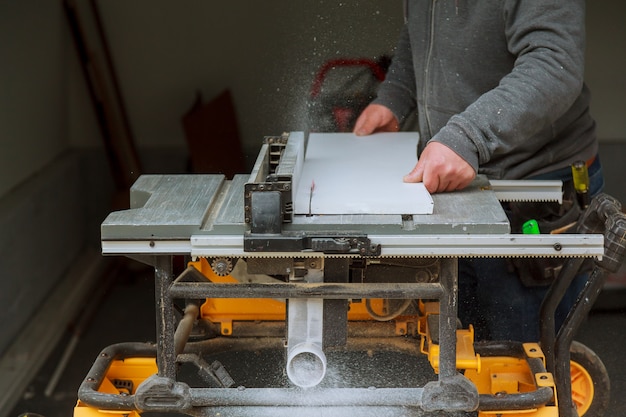 Detail of circular saw cutting piece of wood